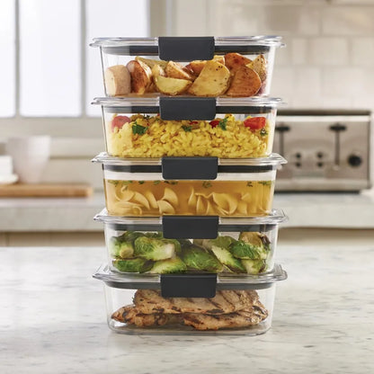 Stack of food storage containers with meals inside on a kitchen counter.